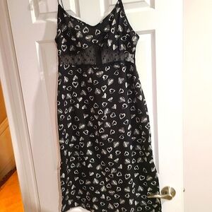 Gorgeous knee length summer dress with lace cut out all around to back.